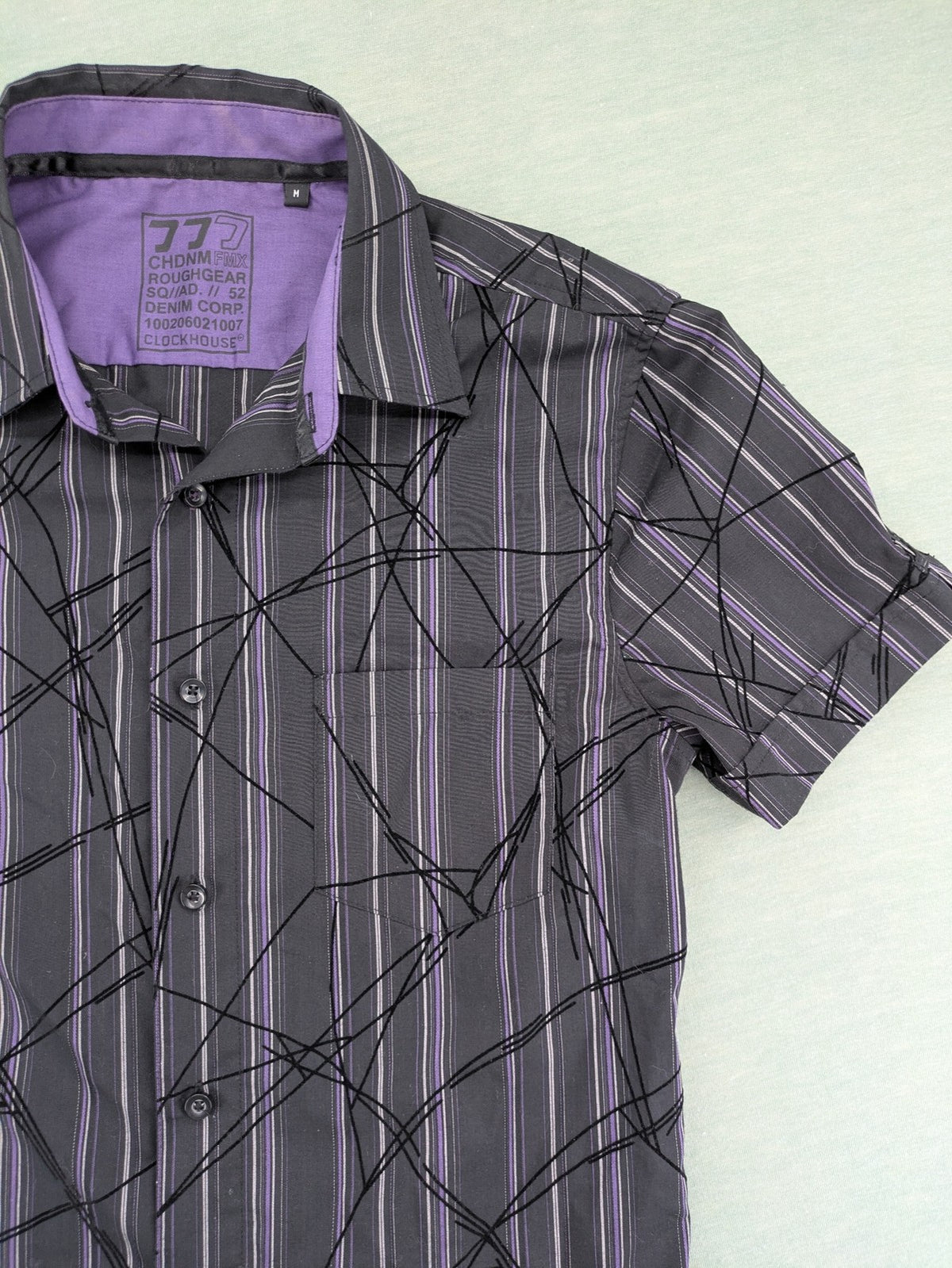 Clockhouse short-sleeve shirt grey purple striped with abstract black graphic pattern and purple collar.