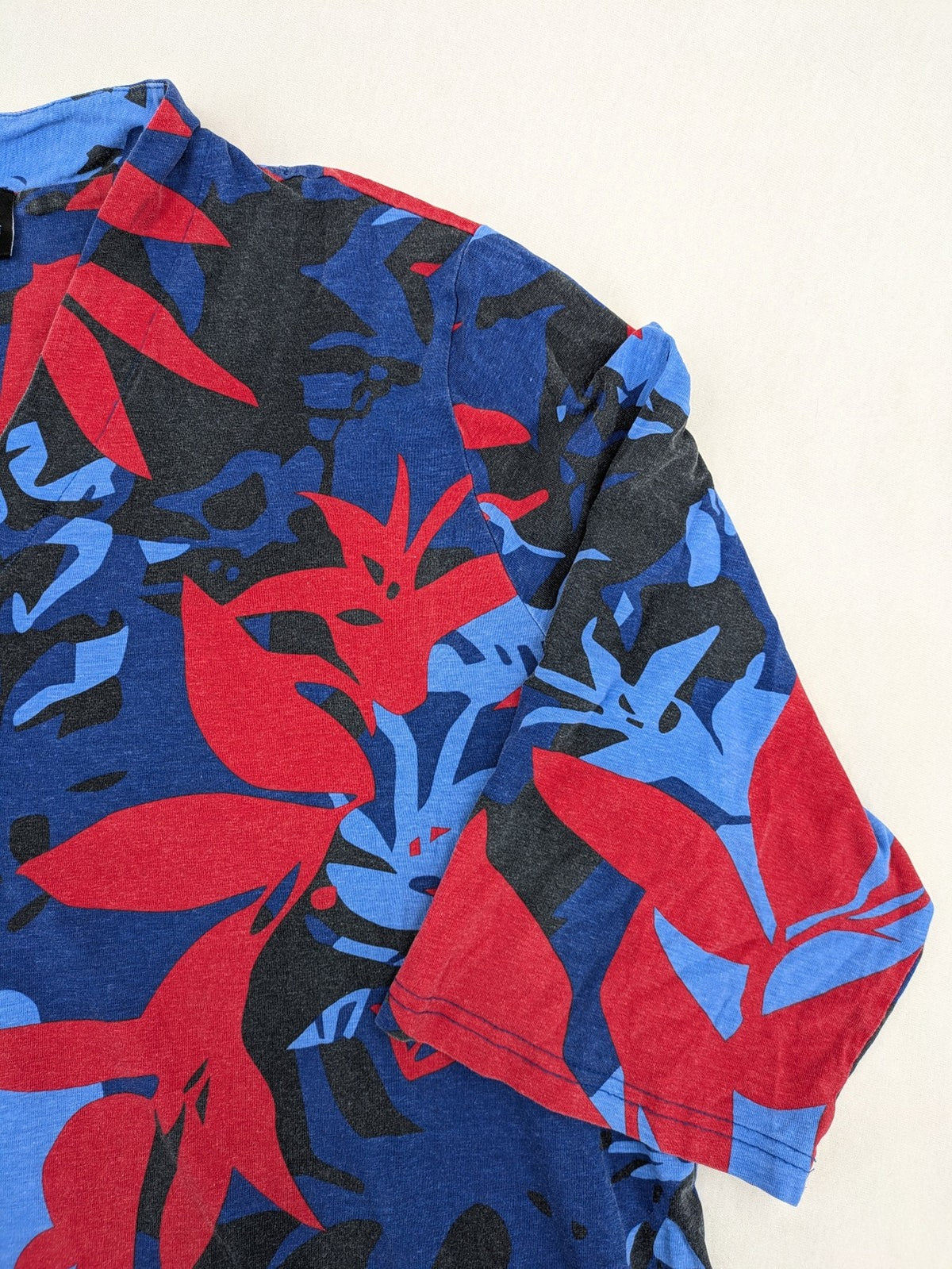 Ulla Popken blue top with floral print, V-neck, 3/4 sleeves, soft cotton blend.