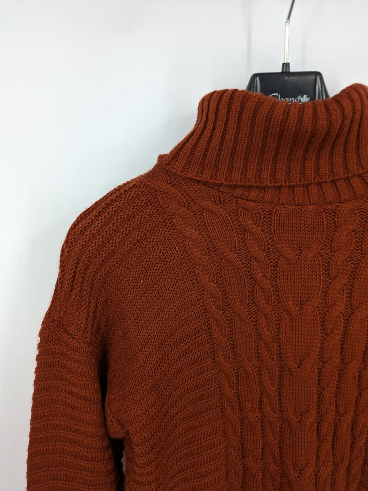 Braun brown turtle neck jumper with decorative cable knit pattern and long sleeves.