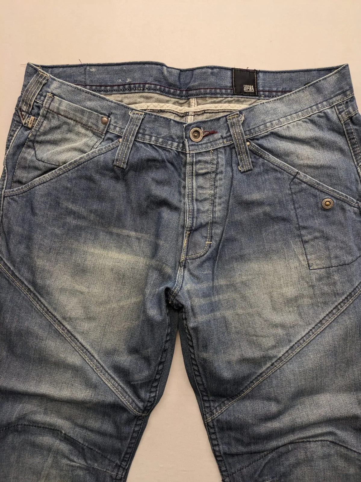Jack & Jones blue straight jeans with biker panel details and button-fly closure.