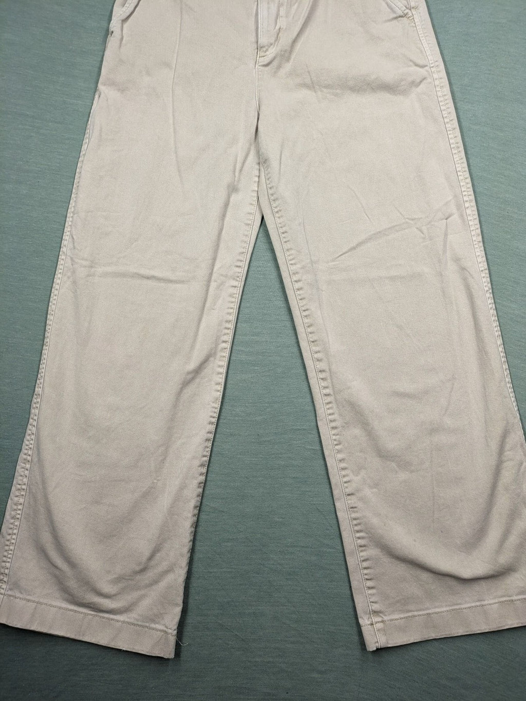 Gap beige loose-fit chino pants made from 100% cotton with relaxed wide-leg design.