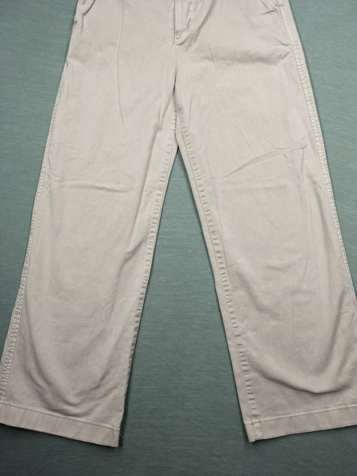 Gap beige loose-fit chino pants made from 100% cotton with relaxed wide-leg design.