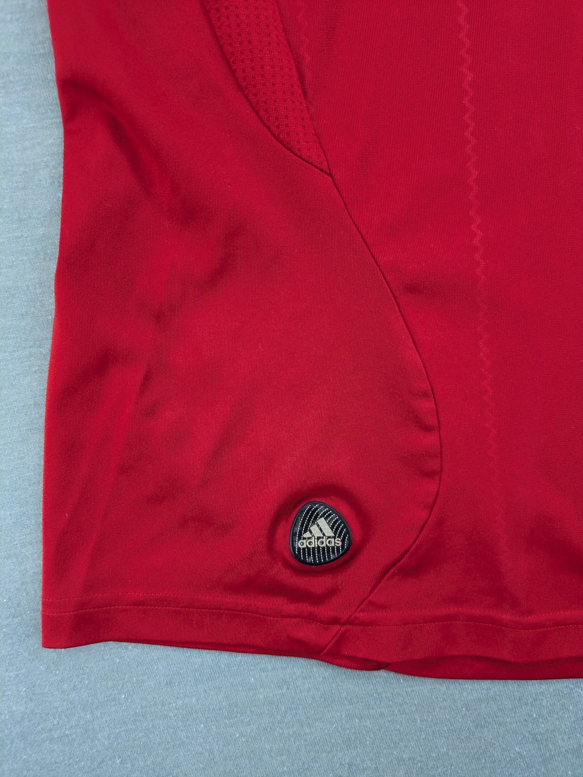 Adidas red soccer uniform with embroidered FC Bayern München crest and T-Mobile logo.