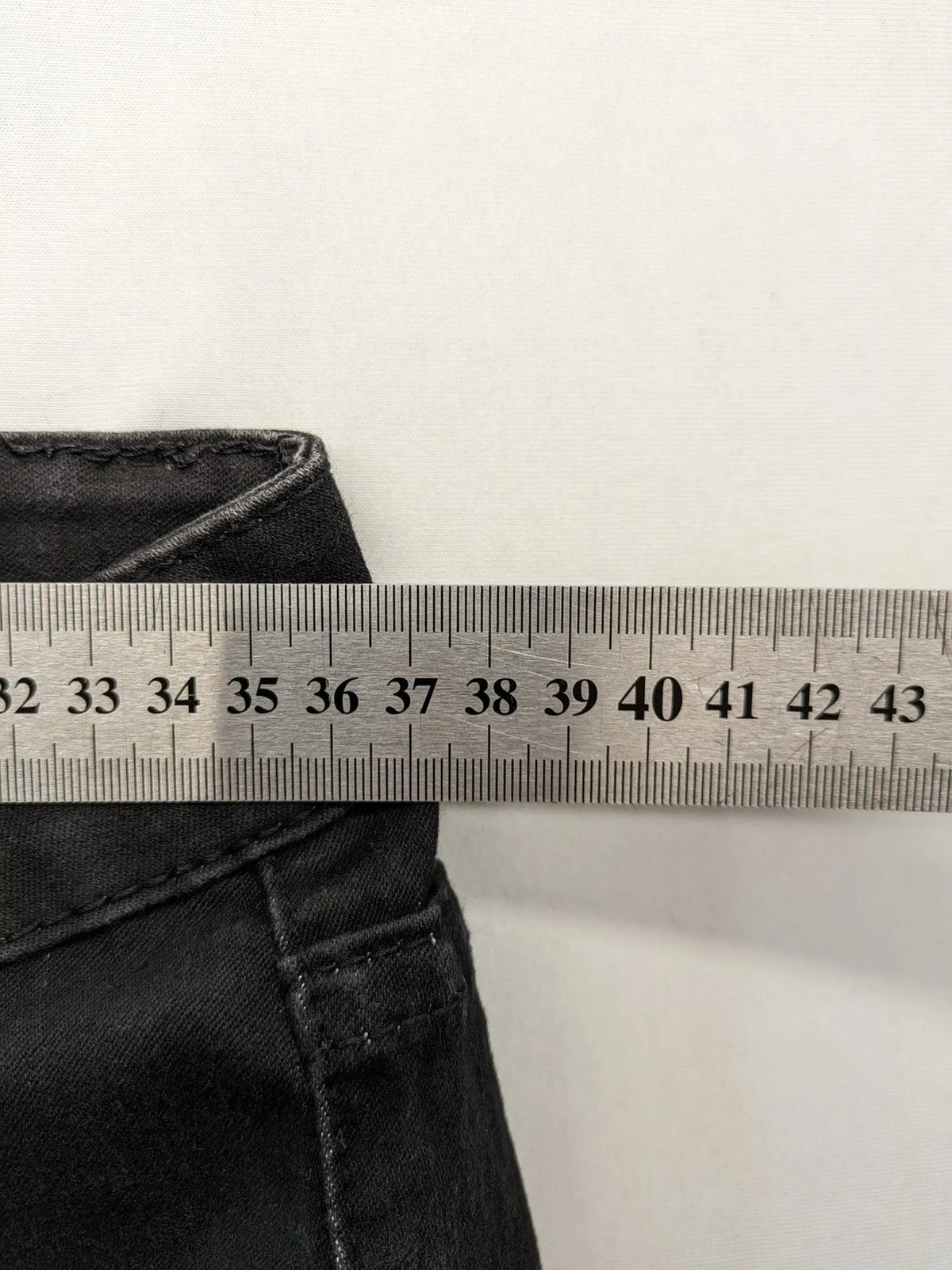 L & K Kaha black straight jeans with rhinestone logo patch and classic 5-pocket design.