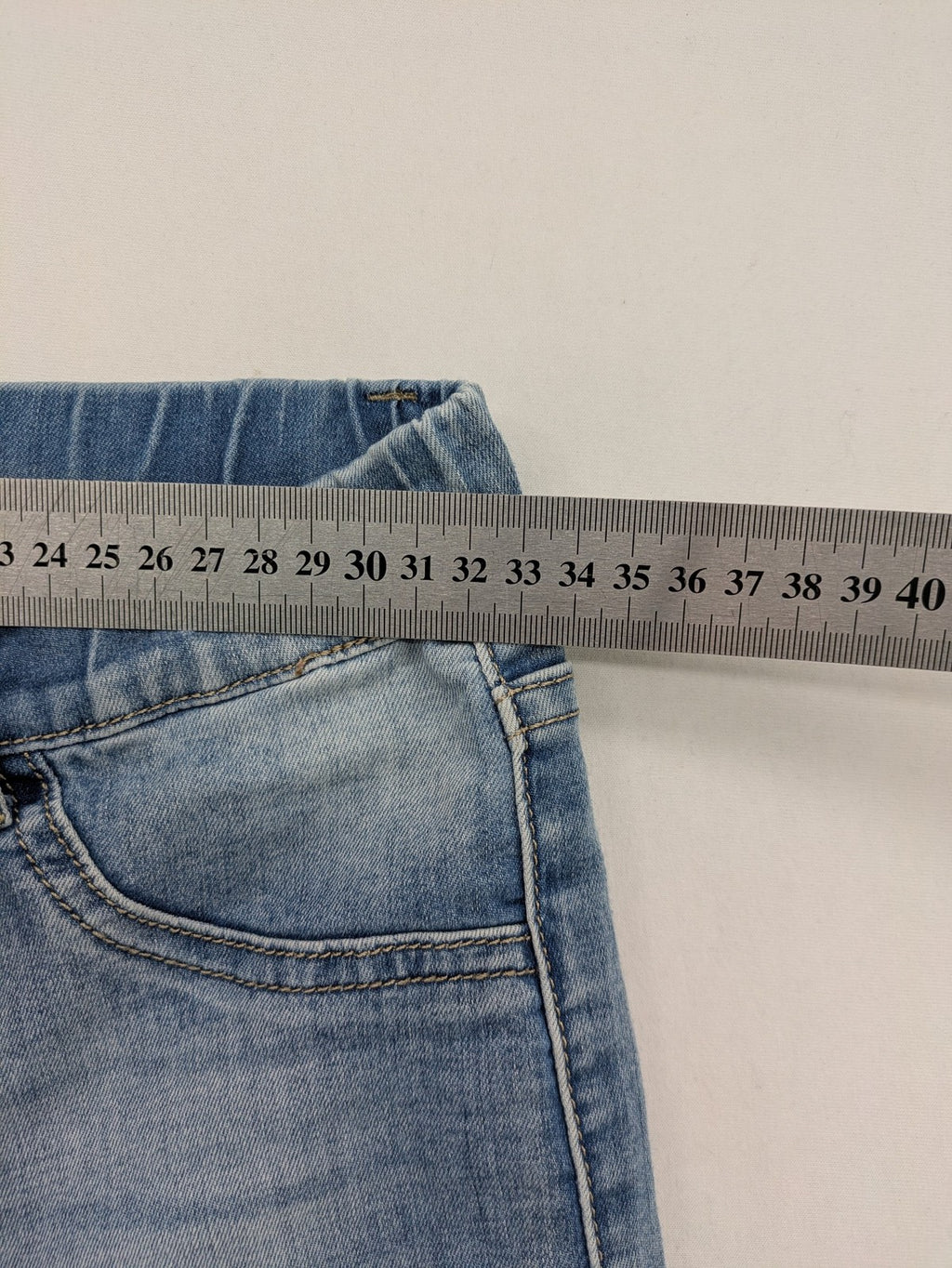 Miss Bonbon blue skinny jeans jeggings with elastic pull-on waistband and light wash.