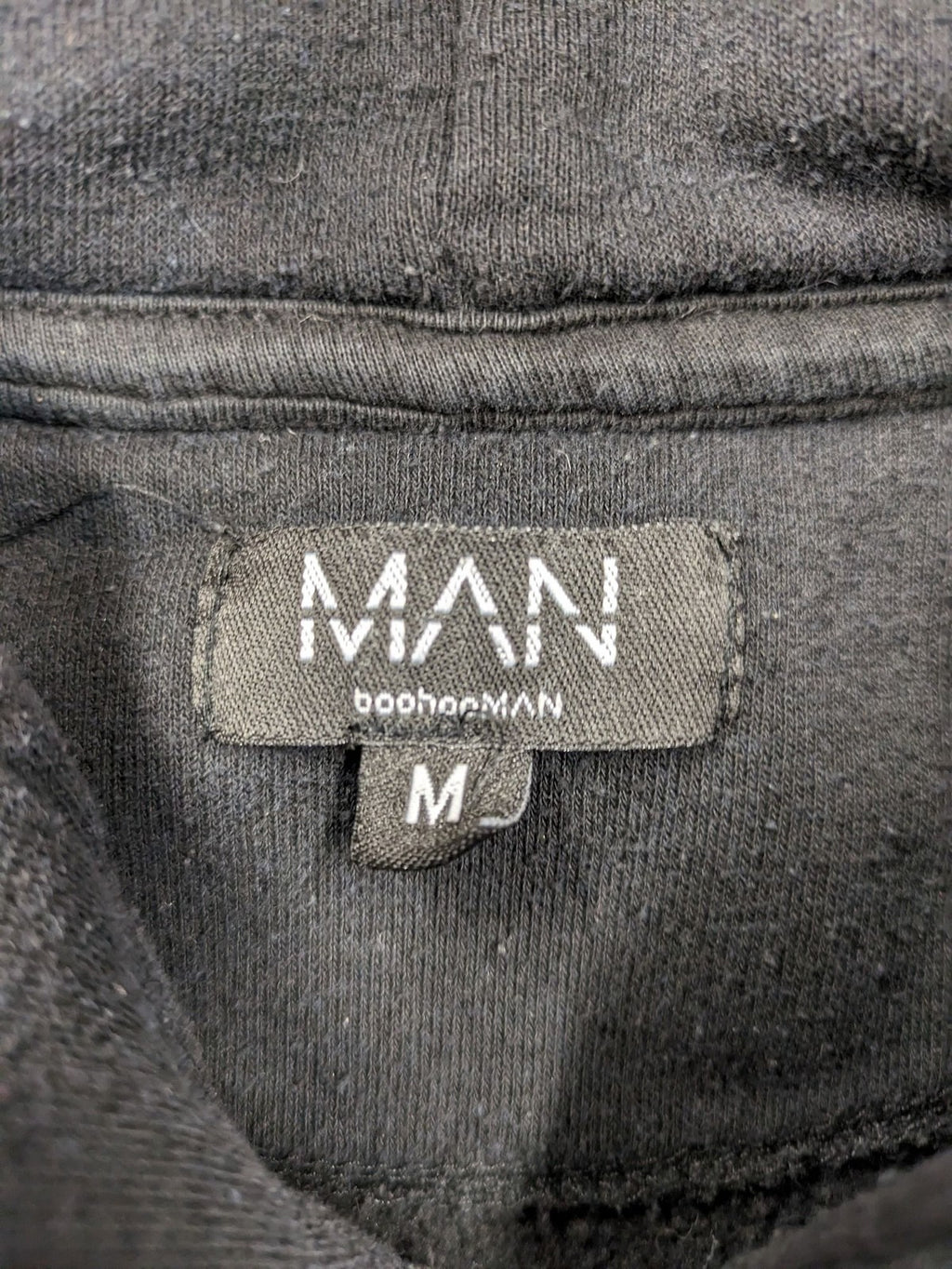 Boohooman zip-through hoodie black with floral graphic and "Limited Edition Collection" text.