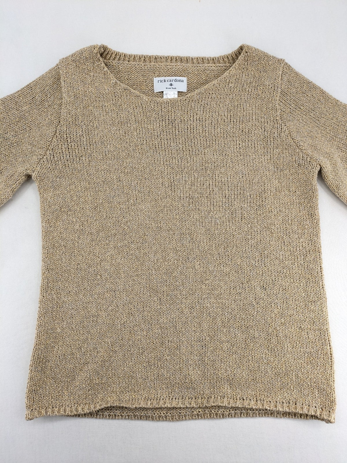 Rick Cardona beige turtle neck jumper with gold metallic thread and balloon sleeves.