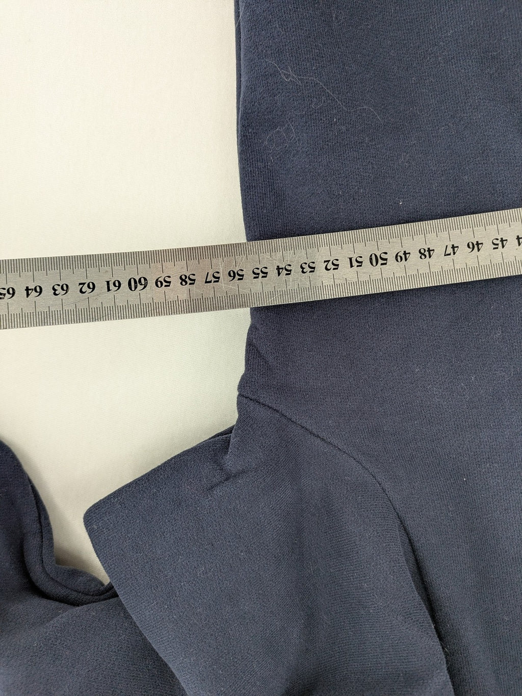 Superdry navy sweatshirt with embroidered tiger graphic and "JPN 54" chenille detail.