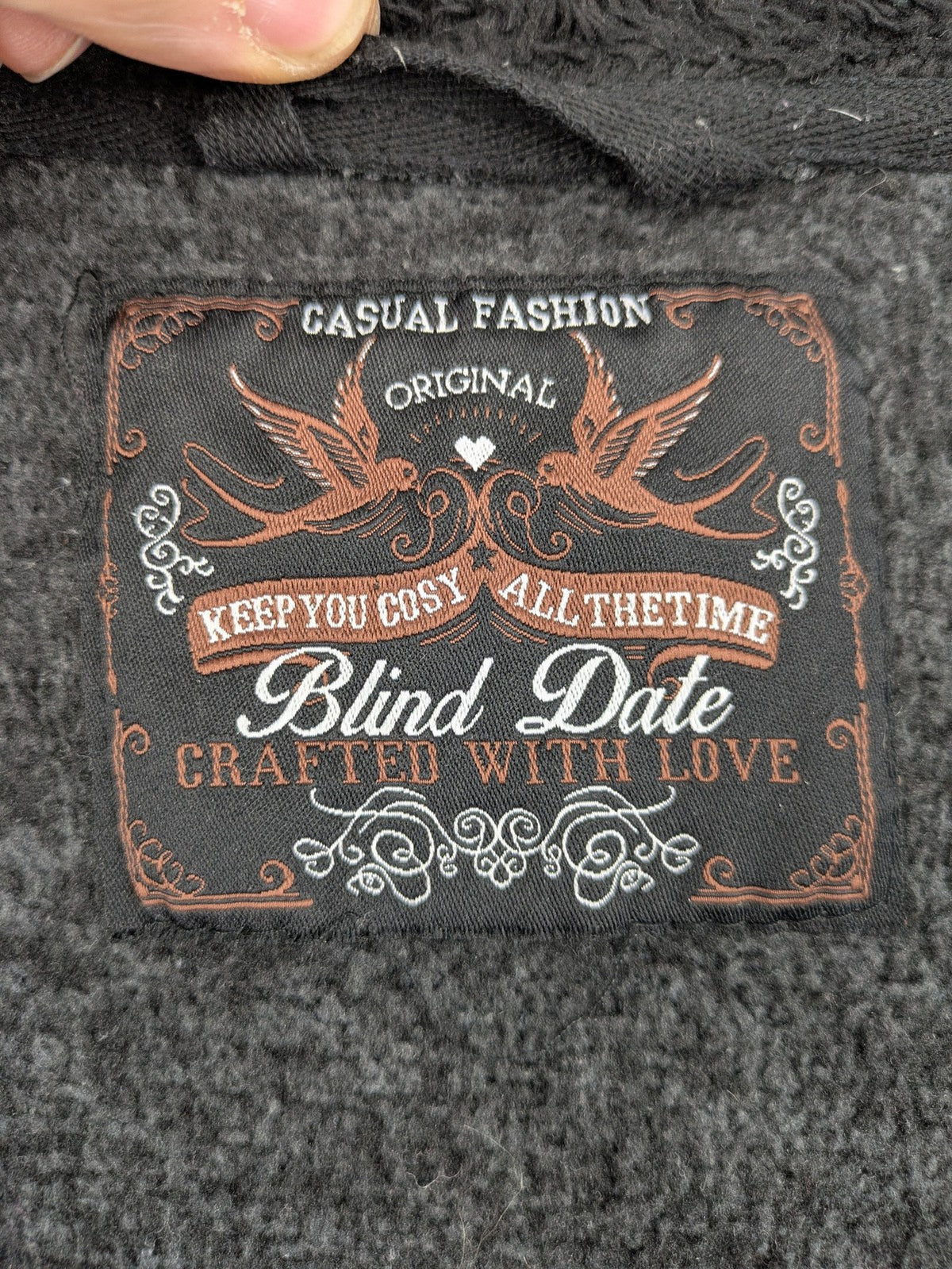 BLIND DATE grey asymmetrical zip hoodie with high fleece-lined waterfall collar.