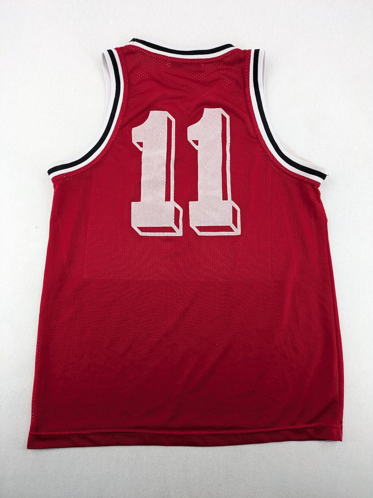 Spalding vintage red basketball jersey size XL, number 11, with black and white striped trim.