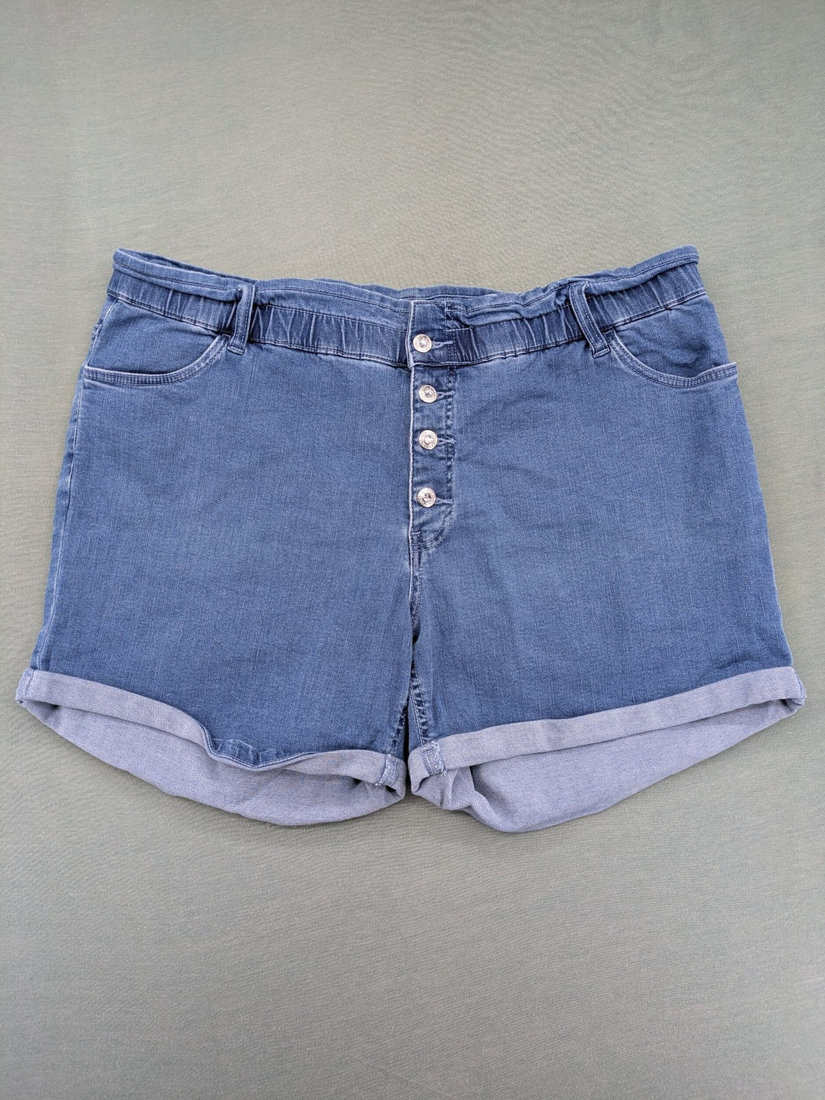 Bodyflirt blue high waist paperbag jeans shorts with button fly and rolled cuffs.