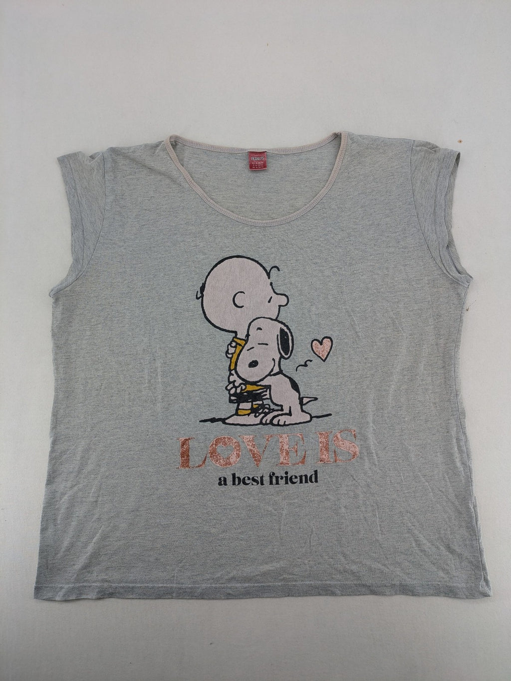 Peanuts brown vintage top with Snoopy and Charlie Brown illustration, rose gold text.