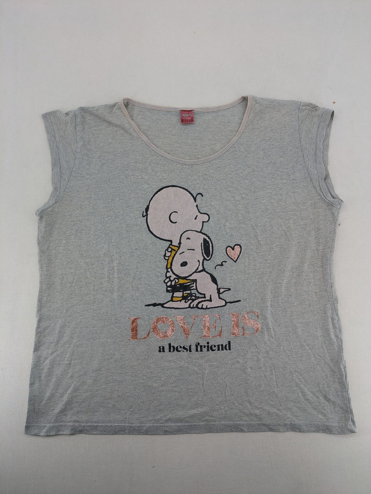Peanuts brown vintage top with Snoopy and Charlie Brown illustration, rose gold text.
