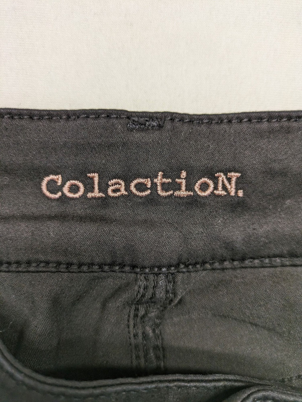 Colac black straight jeans high waist with double button, zipper pockets, and stretch material.