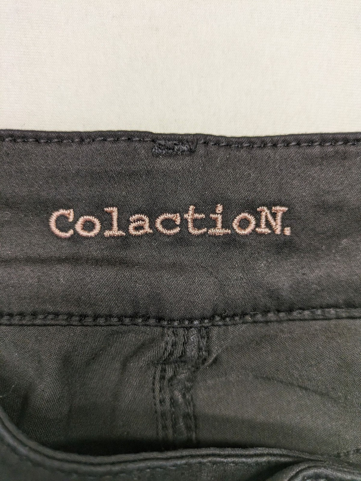 Colac black straight jeans high waist with double button, zipper pockets, and stretch material.