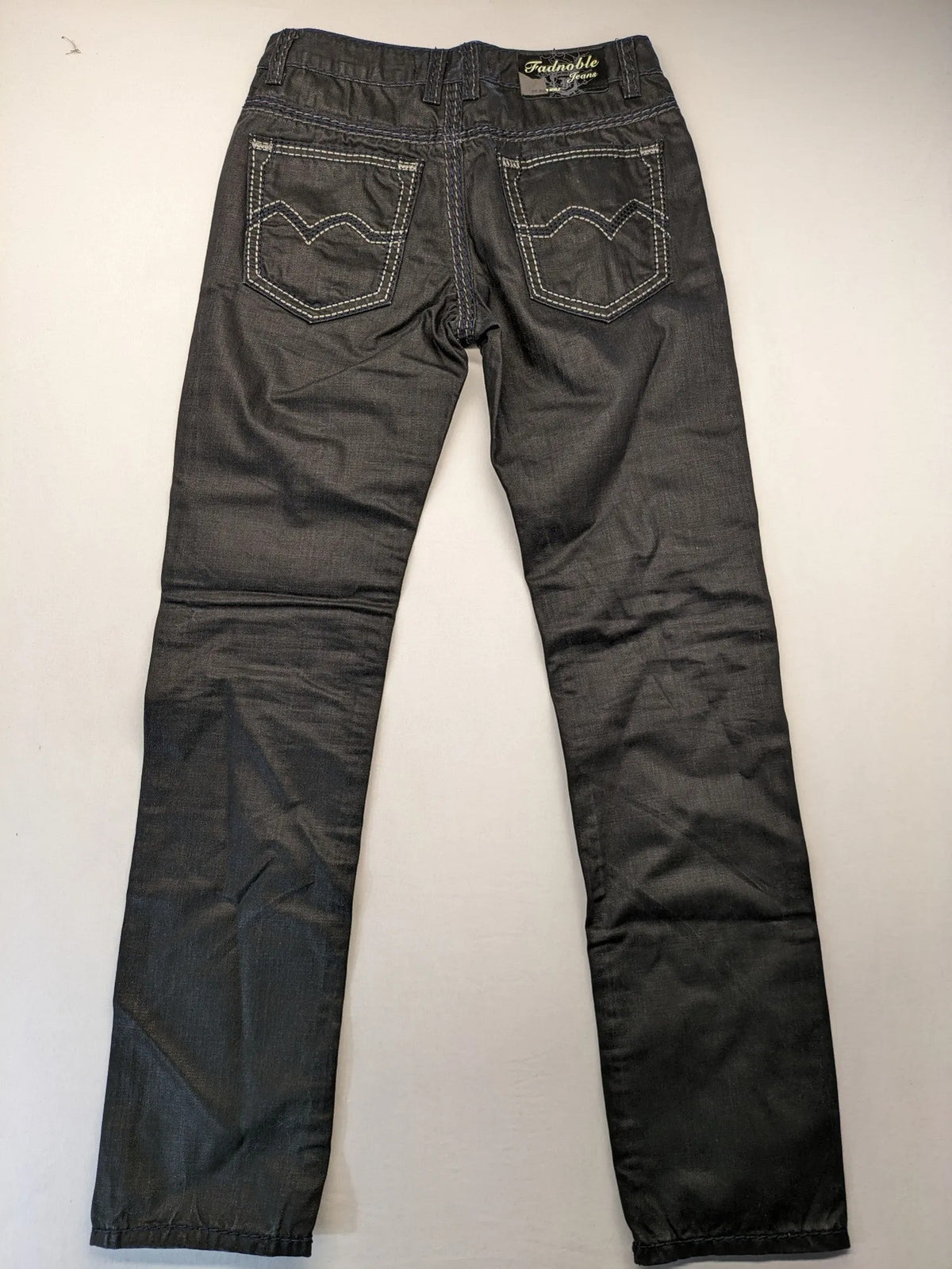 Fadnoble grey straight jeans with button fly and contrasting stitching details.