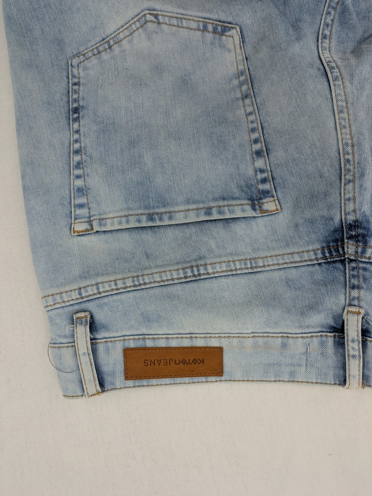 Koton Jeans blue straight jeans with distressed details and classic 5-pocket style.