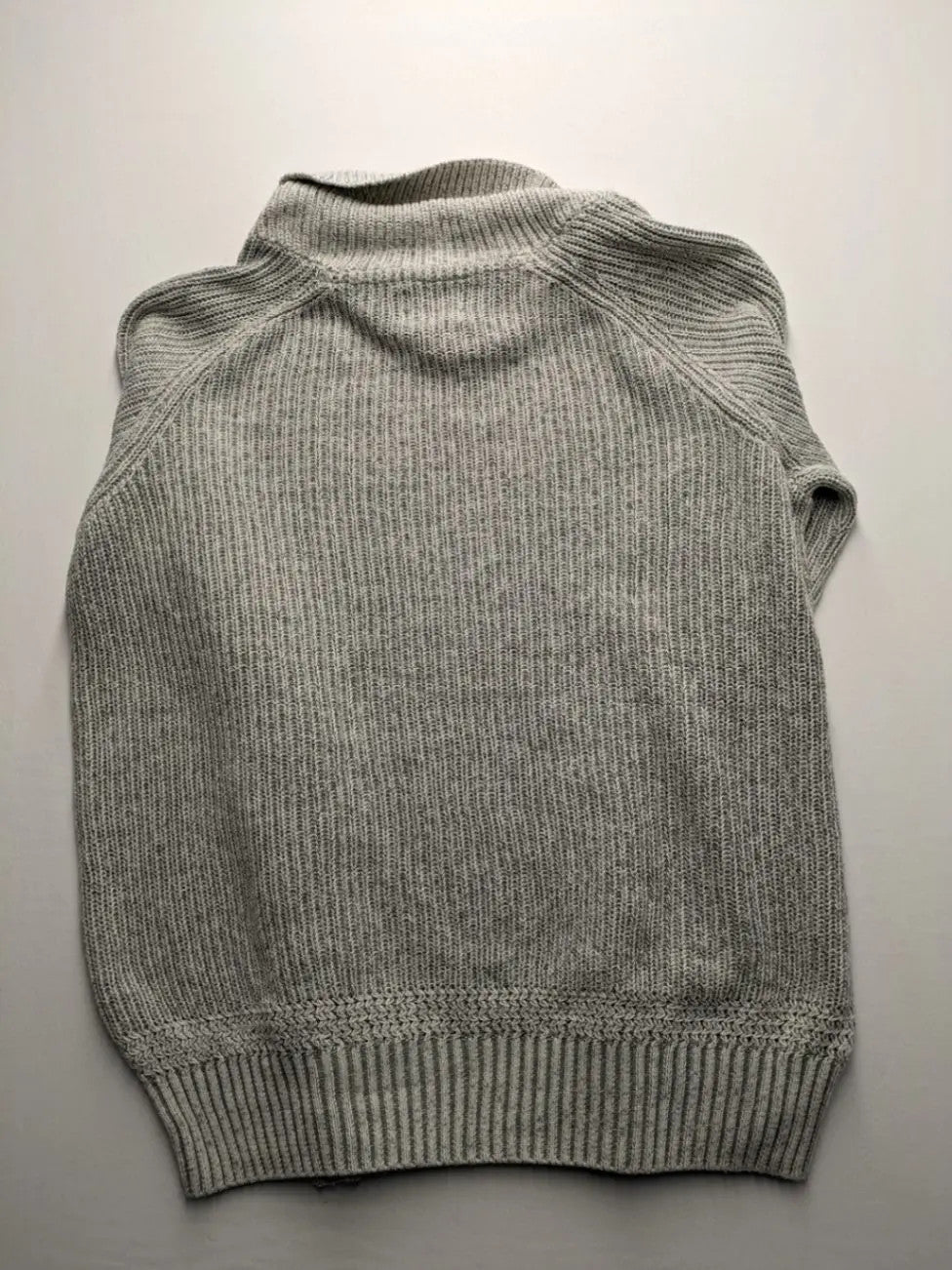 Autumn Glow grey turtle neck jumper with ribbed pattern and button detail.