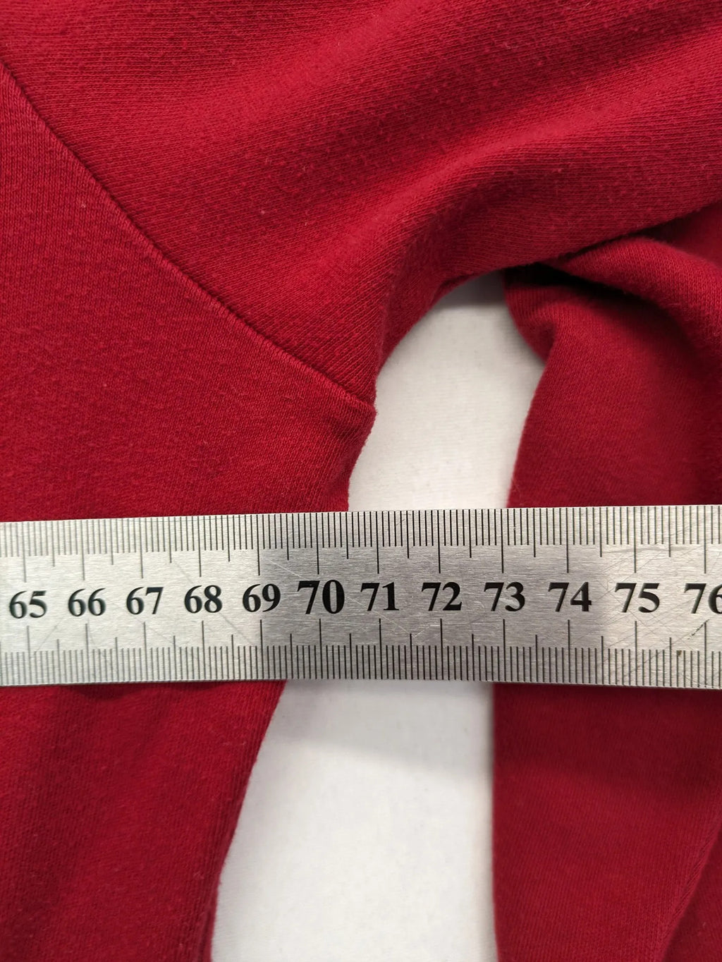 Normann red turtle neck jumper with large anchor print and side pockets.