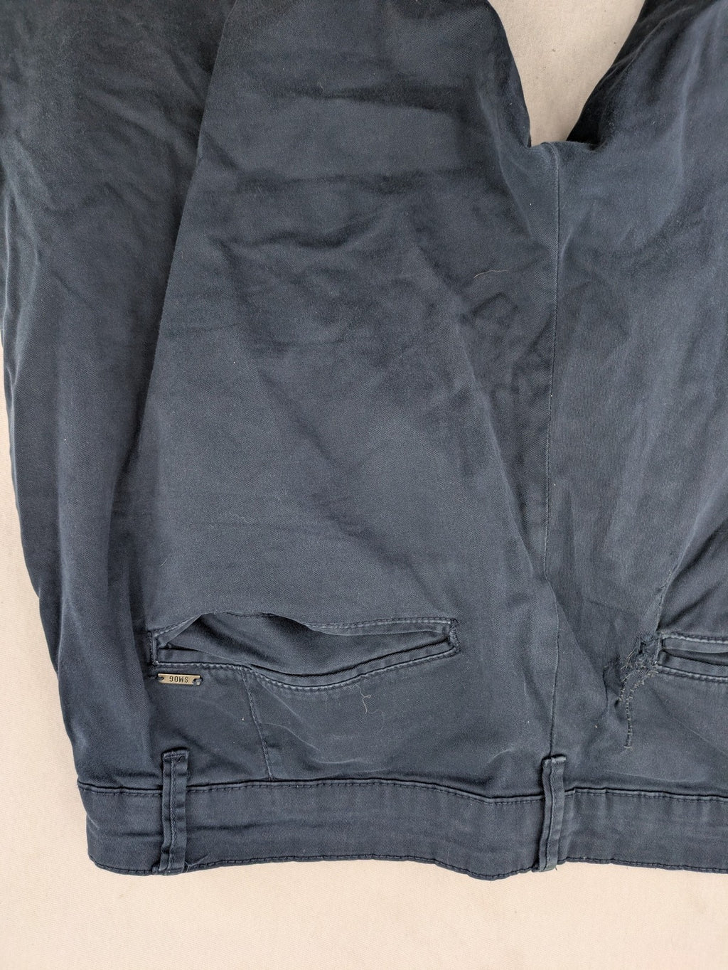 smog blue chino pants with belt loops, button fly, and side pockets