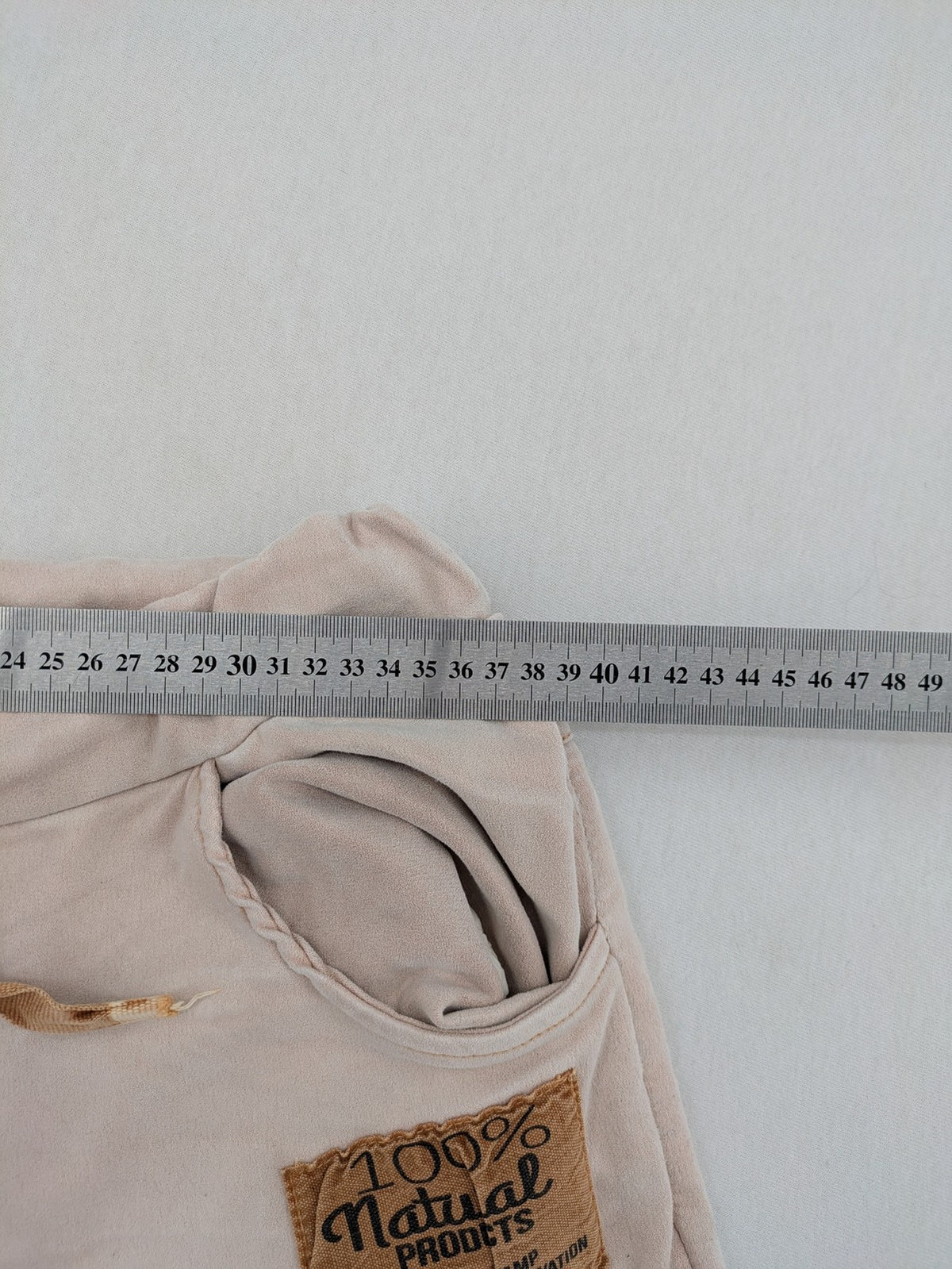 Made In Italy beige pants with crinkle texture and rock-style patches, drawstring waist.
