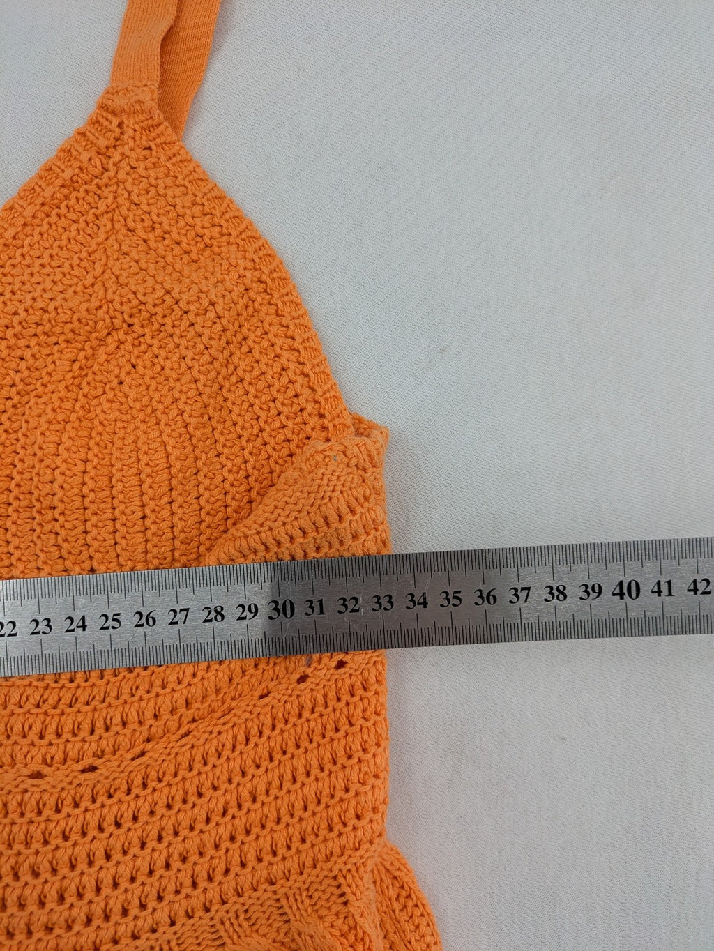 REVIEW orange crochet top with V-neck and peplum hem, made from 100% cotton.