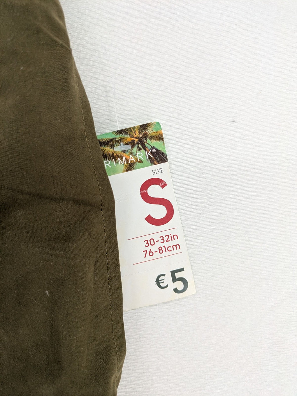 Primark khaki swim shorts size S with elastic waistband and back pocket.
