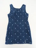 Damen blue denim mini dress with all-over white and light blue floral embroidery.
