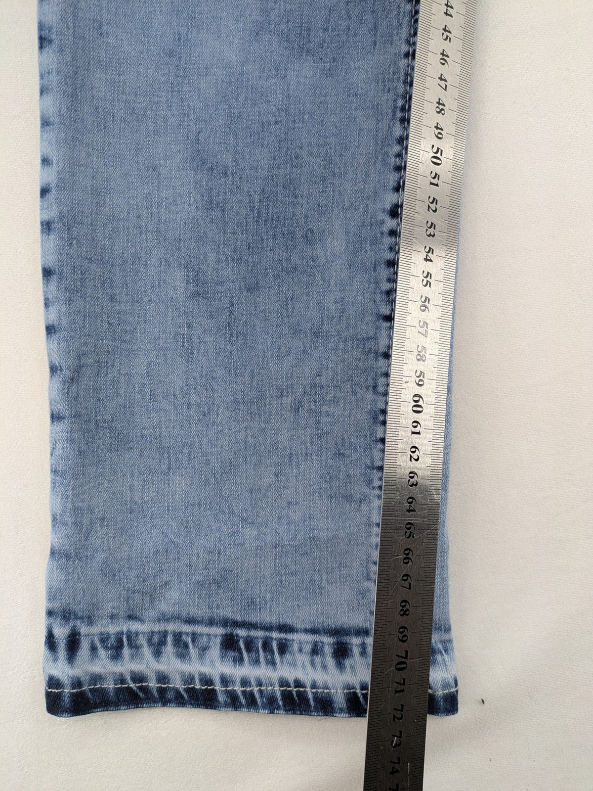 Multiblu blue straight jeans slim fit with decorative front zippers and light wash.
