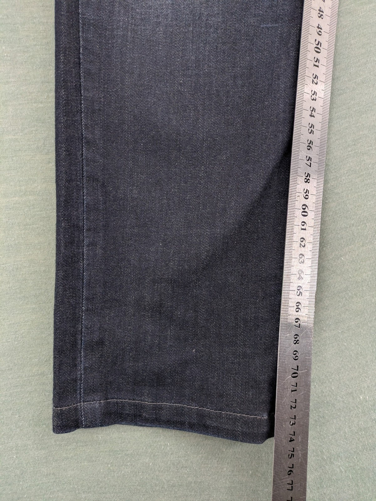 Mac Jeans blue straight jeans dark wash with subtle fading and stretch denim material.