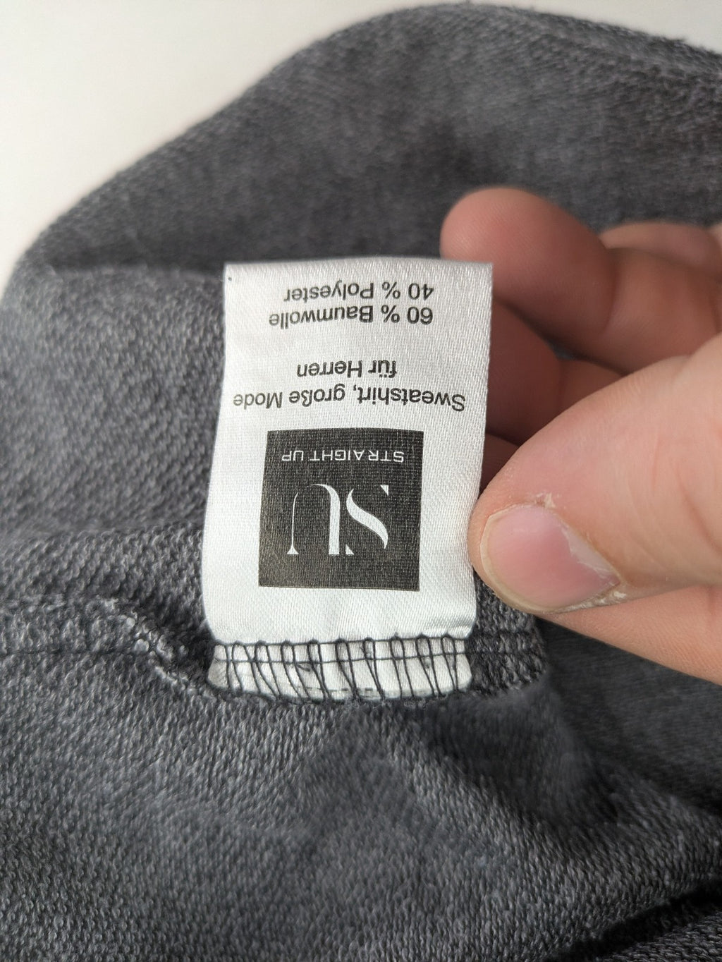 Straight Up grey turtle neck jumper with zip collar and subtle graphic print.