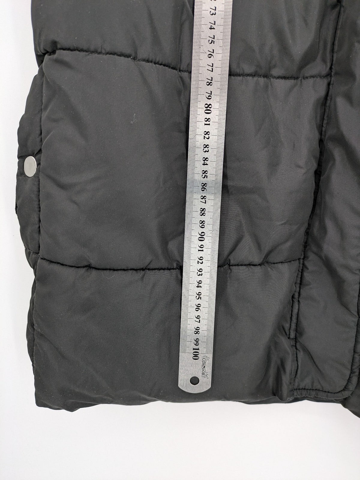 Zeeman grey quilted coat size 38 with hood and side snap buttons.