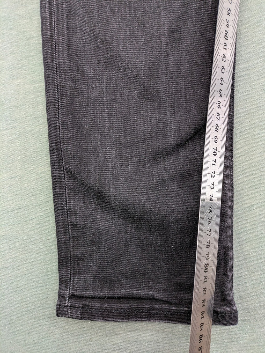 Jack & Jones black slim fit jeans faded wash stretch denim with logo detail.