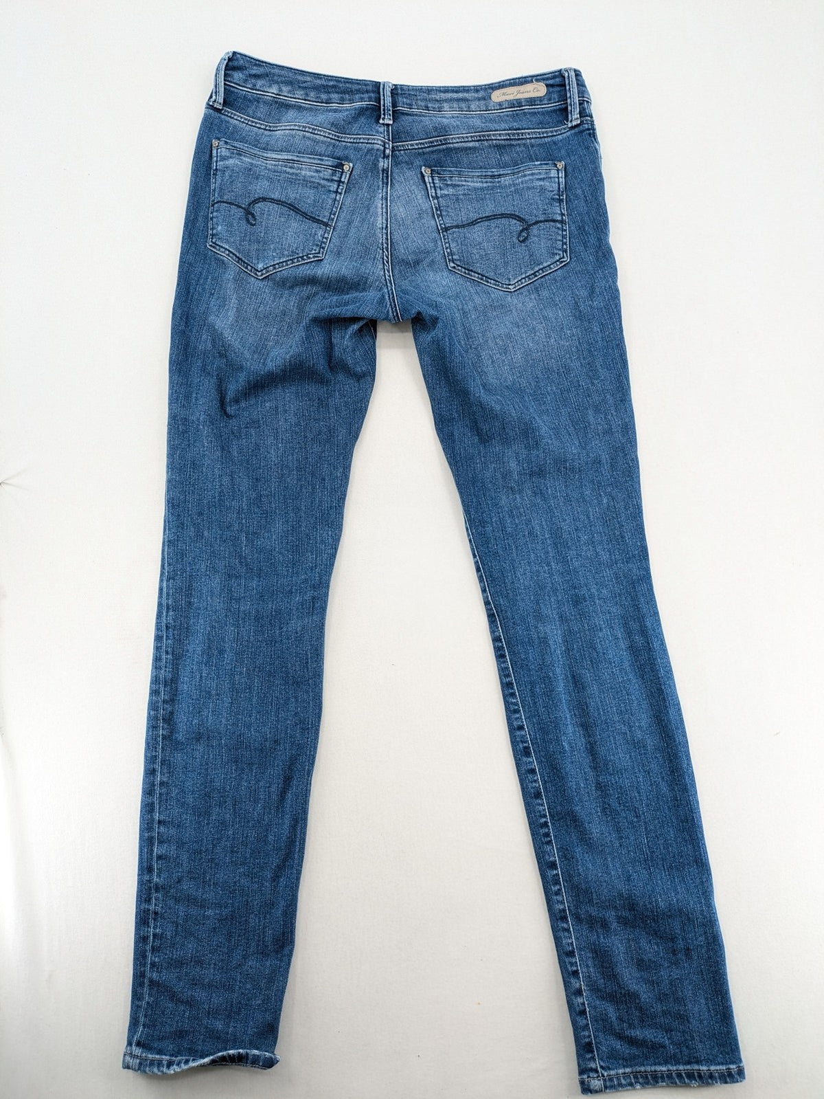 Mavi blue straight leg jeans with classic 5-pocket styling and medium wash.