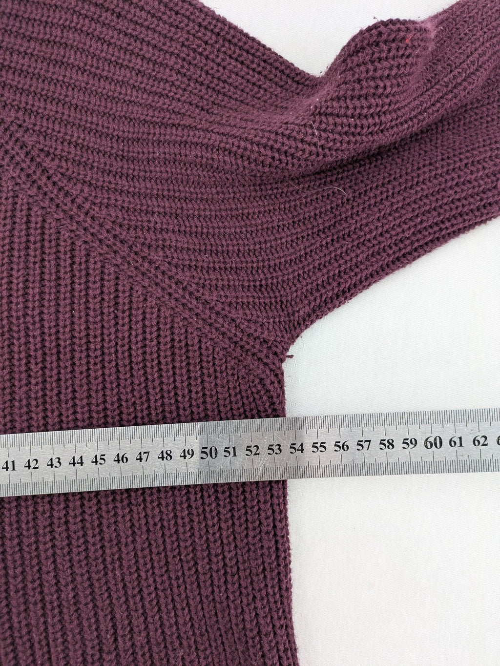 Monari burgundy knit jumper with standing collar, ribbed texture, and raglan sleeves.