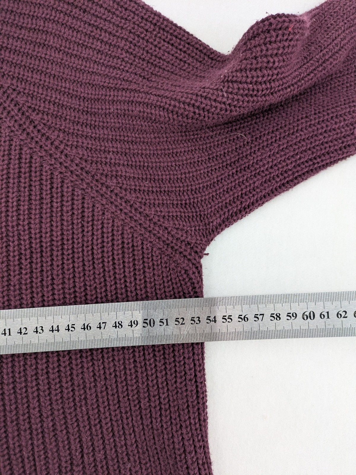 Monari burgundy knit jumper with standing collar, ribbed texture, and raglan sleeves.