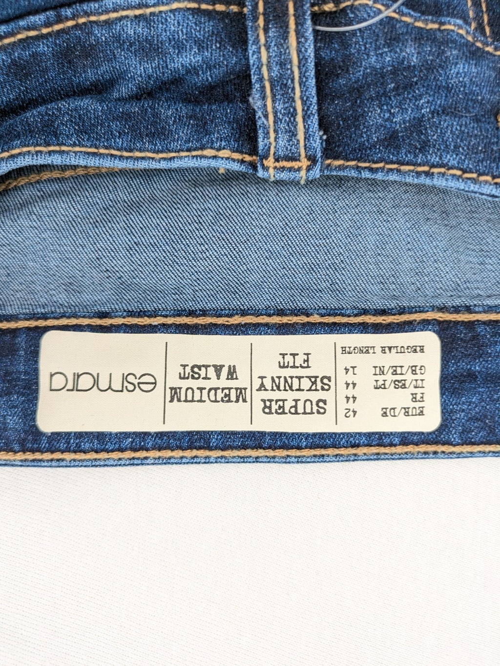 ESMARA blue super skinny jeans with dark wash and stretch denim material.