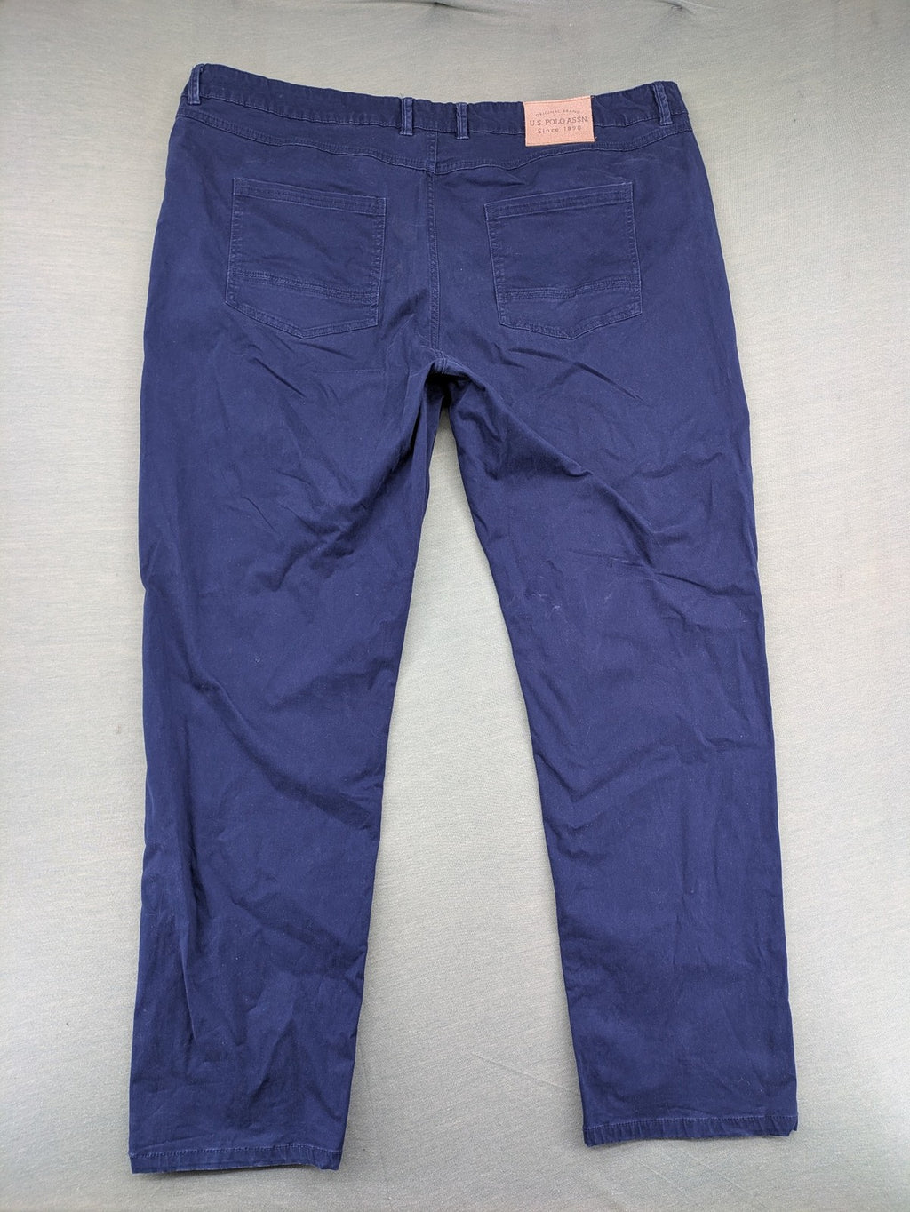 U.S. Polo Assn. navy chino pants classic 5-pocket design with subtle logo stitching