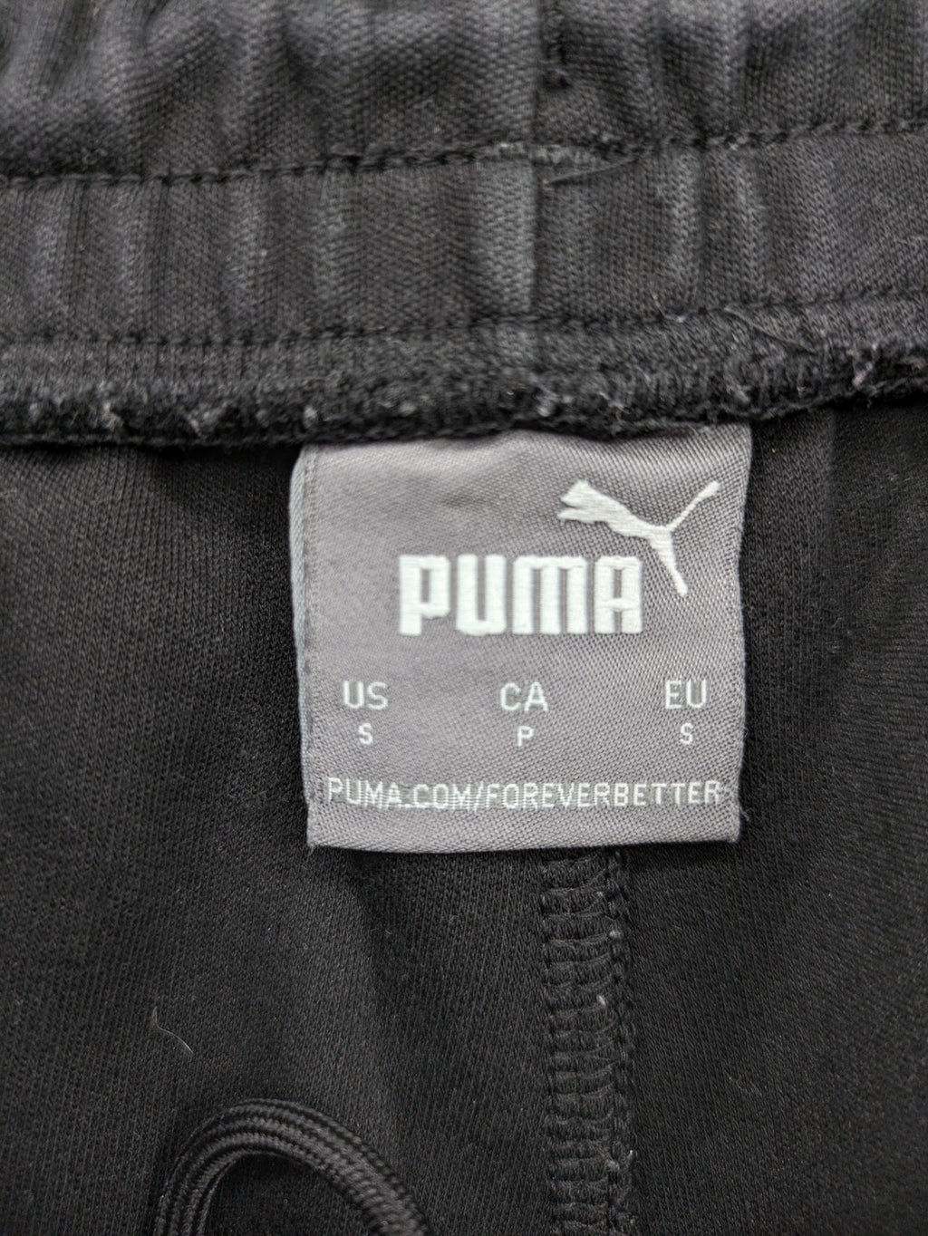 Puma grey sweatshorts featuring Mercedes AMG Petronas logo and elastic waistband.