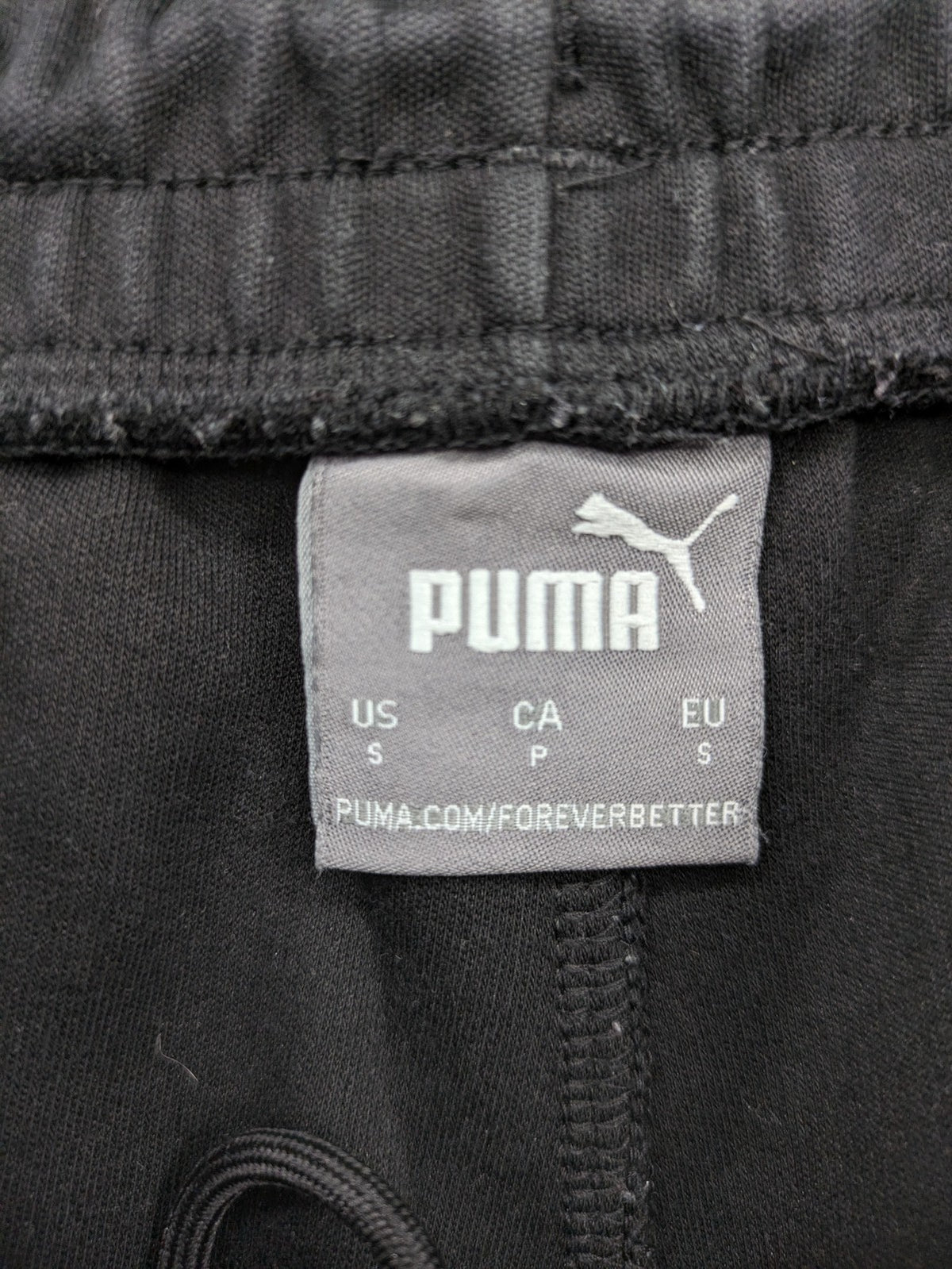 Puma grey sweatshorts featuring Mercedes AMG Petronas logo and elastic waistband.