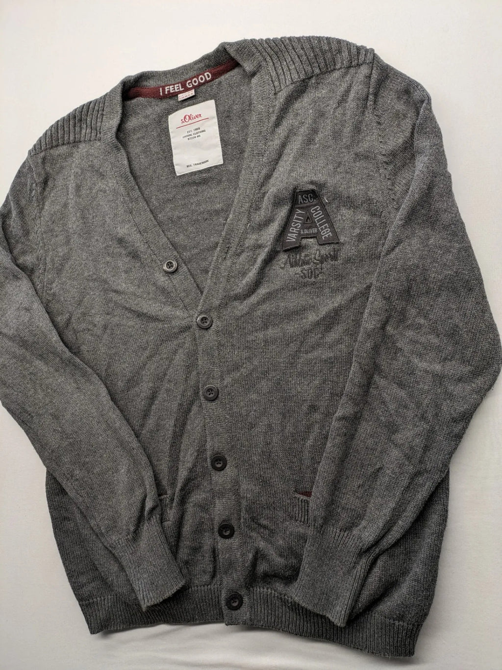 s.Oliver grey turtle neck jumper with varsity college patch and button closure.