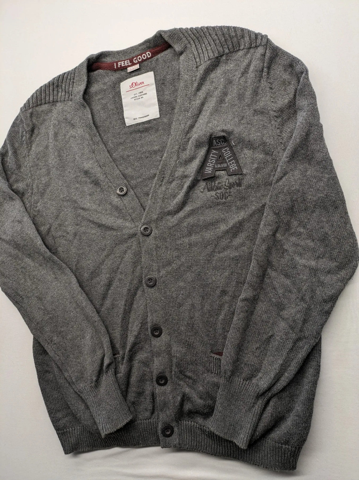 s.Oliver grey turtle neck jumper with varsity college patch and button closure.