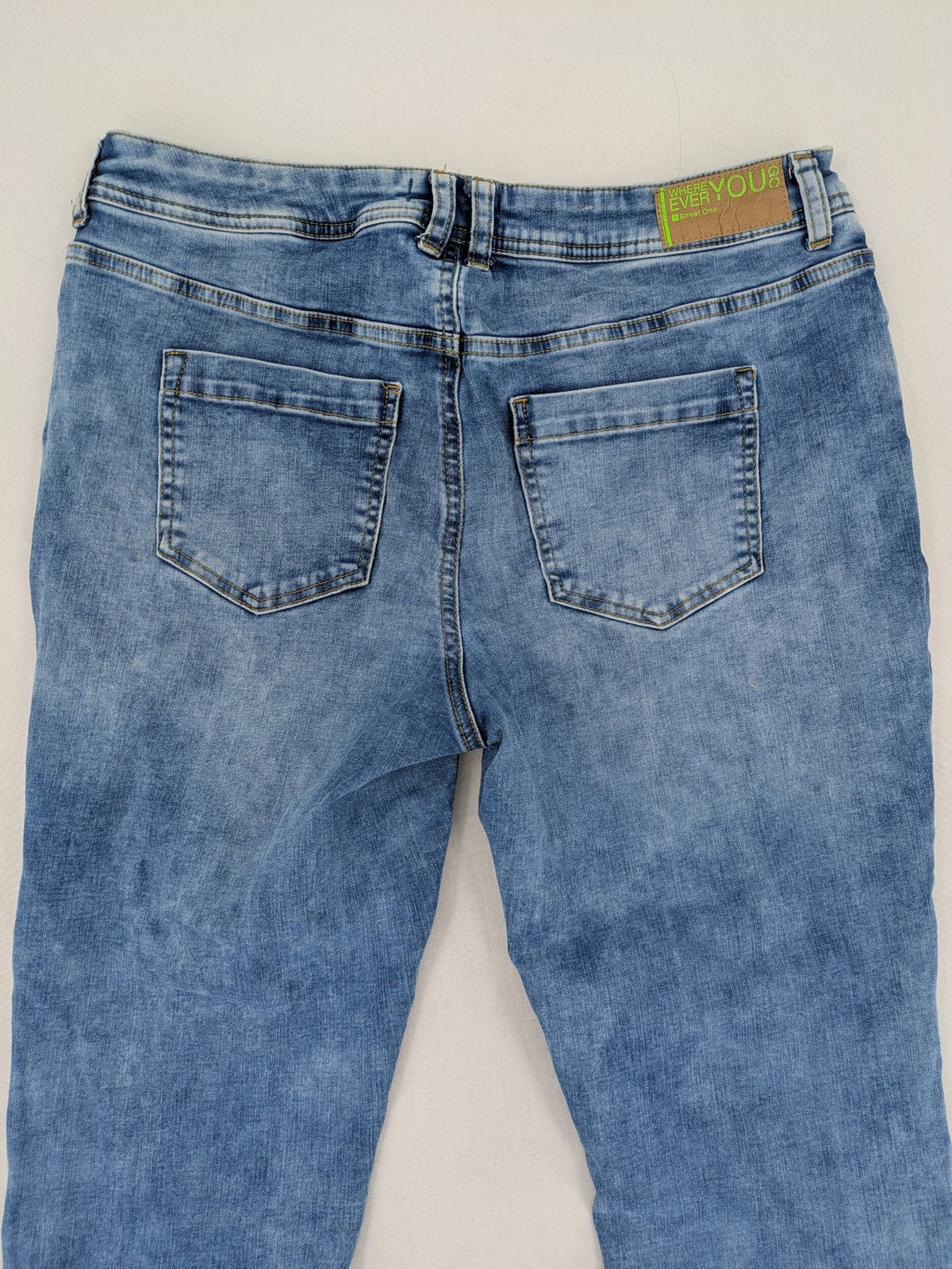Street One blue straight jeans with green patterned cuffs and button fly detail.