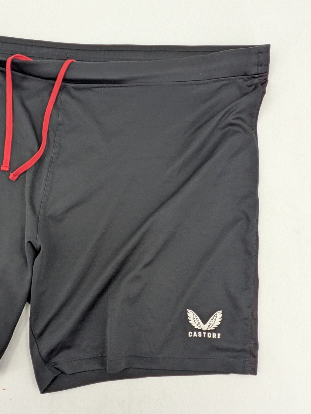Bayer black training shorts with red side stripes, embroidered team crest and Castore logo.
