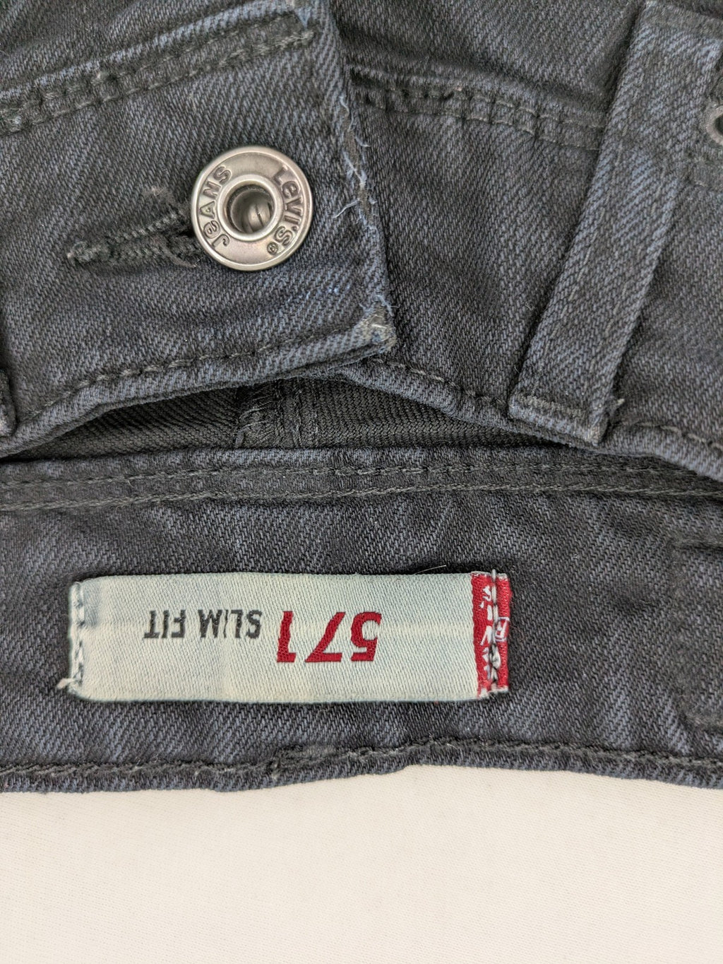 Levi's black slim fit jeans with classic 5-pocket design and zipper fly.