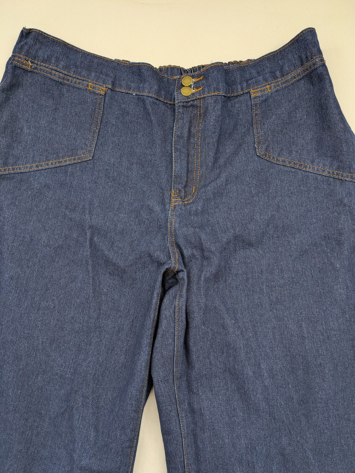 Emery Rose pink culotte pants with wide legs, double button closure, and soft denim blend.