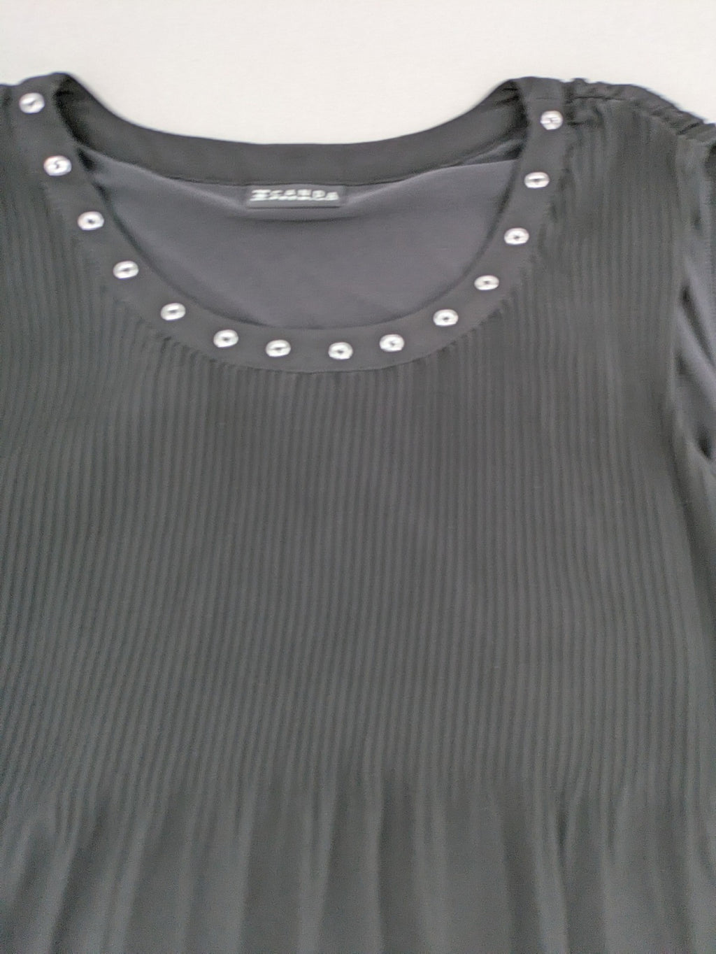 C&A grey top sleeveless pleated chiffon overlay with silver studs at neckline