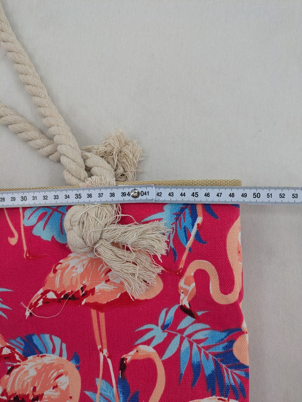Flamingo pink shopping tote with vibrant tropical flamingo and palm leaf pattern.