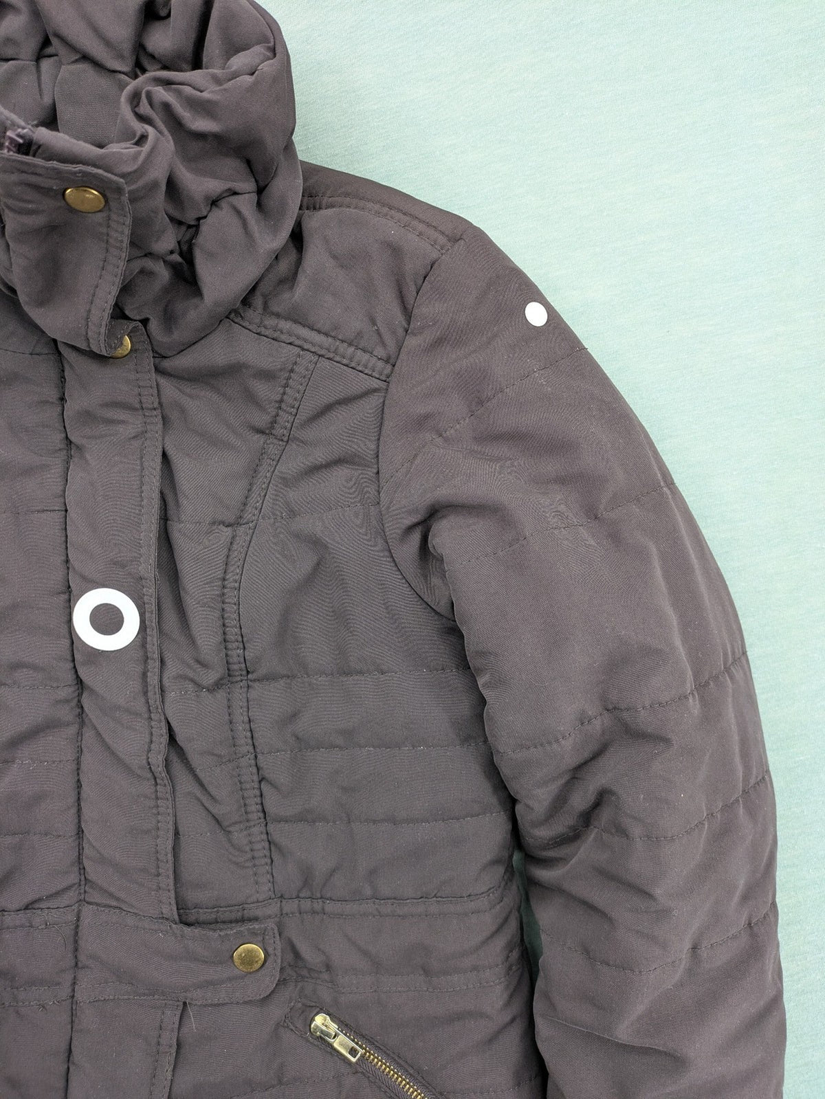 Vero Moda grey quilted jacket with high funnel neck and zippered pockets.