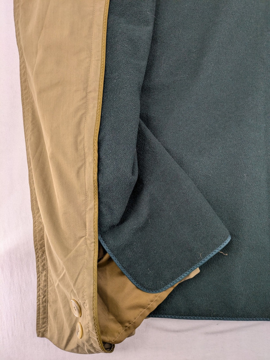Studio Novum khaki trench coat double-breasted design with belt and wool lining.
